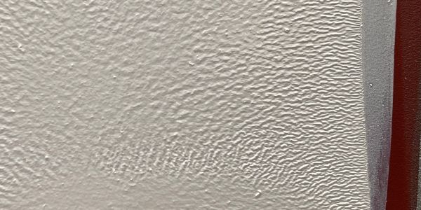 White wrinkled paint on flat surface